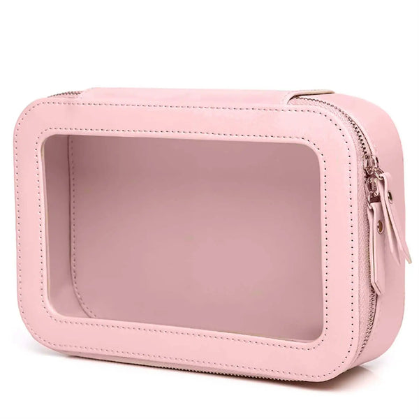 A pink clear waterproof cosmetic travel pouch with a rectangular design and zipper closure.