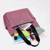 A mauve nylon shoulder tote bag is shown open, with a smartphone and other accessories inside.