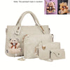 A beige fashion embossed PU handbag set featuring a large tote bag and a smaller wallet, with bear-themed charms.