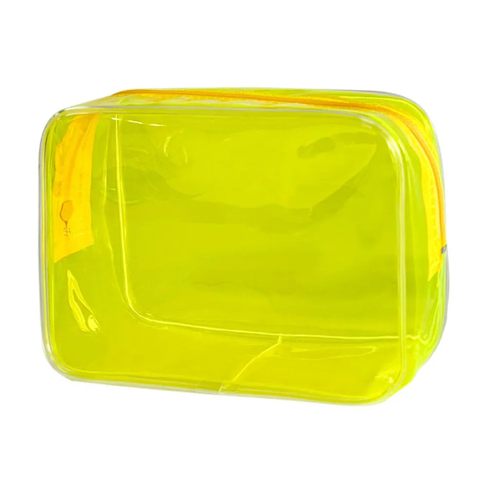 A transparent yellow PVC travel makeup bag with a zipper closure.
