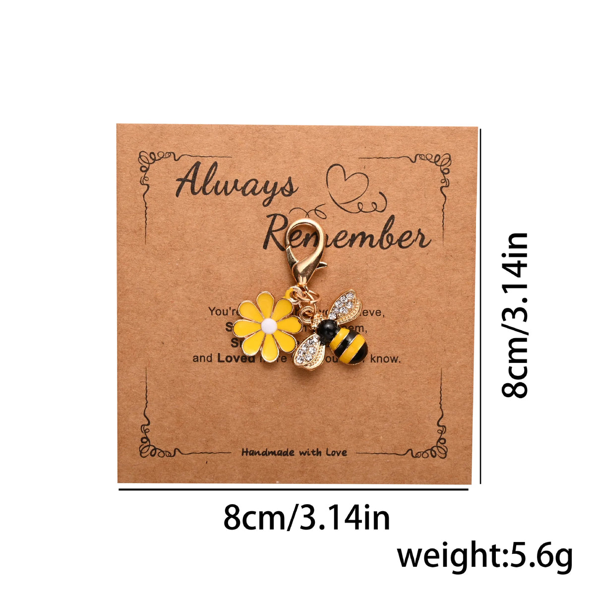 A gold-colored beaded flower keychain with a butterfly detail is displayed on brown kraft paper.