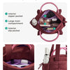 Bolso acolchado marrón en forma de puff con bolsillos interiores y exteriores para uso diario y ocio.
