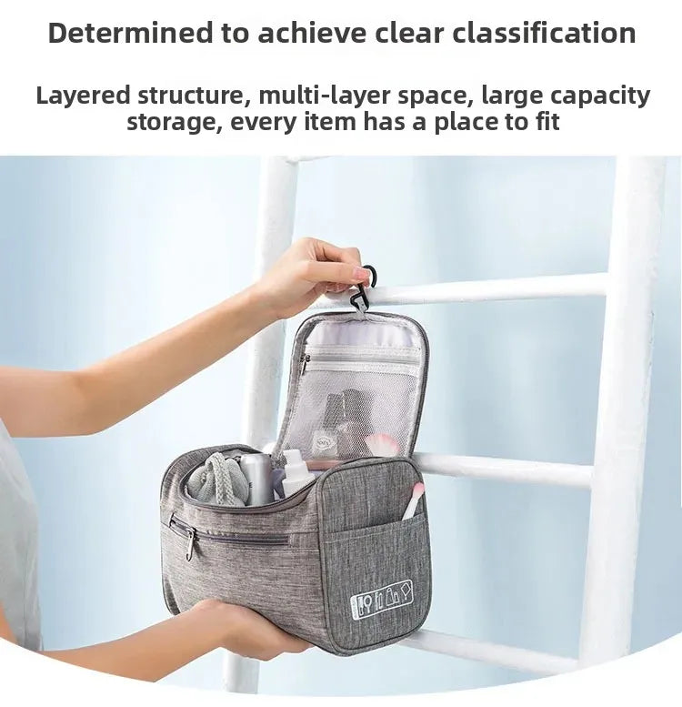 A hand is placing a gray portable toiletry bag onto a white wooden ladder.