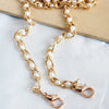 Gold-toned adjustable chain strap made of small white pearls
