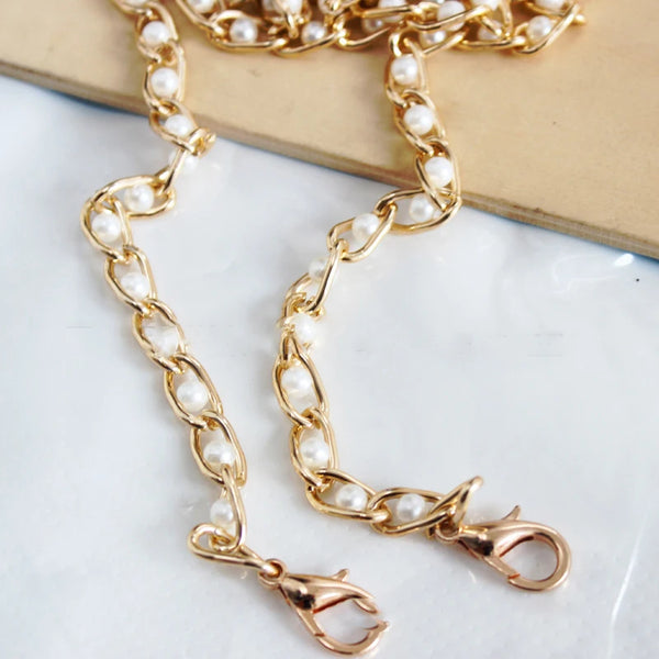 Gold-toned adjustable chain strap made of small white pearls