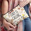 A beige makeup bag featuring an illustration of Italy and text that reads Italy is calling and I must go