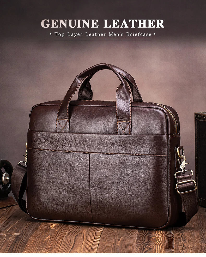 A brown genuine leather men's briefcase with a leather strap and buckle, shown on a wooden surface.