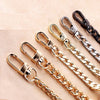 Several gold and black stainless steel diamond-cut curb chain bag straps are displayed on a light background.
