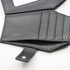 Black leather wallet with vintage embossed design and stitched details.