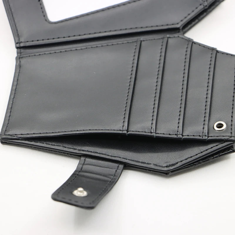 Black leather wallet with vintage embossed design and stitched details.