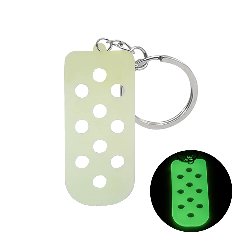 Porte-clés de chaussure en silicone vert clair avec anneau à cliquet argenté.