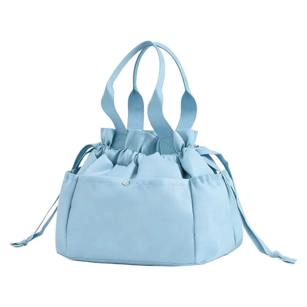Light blue insulated drawstring lunch bag with multi-pocket storage