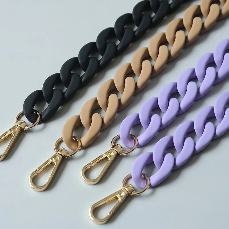 Three adjustable long bag straps in black, beige, and purple colors displayed diagonally.