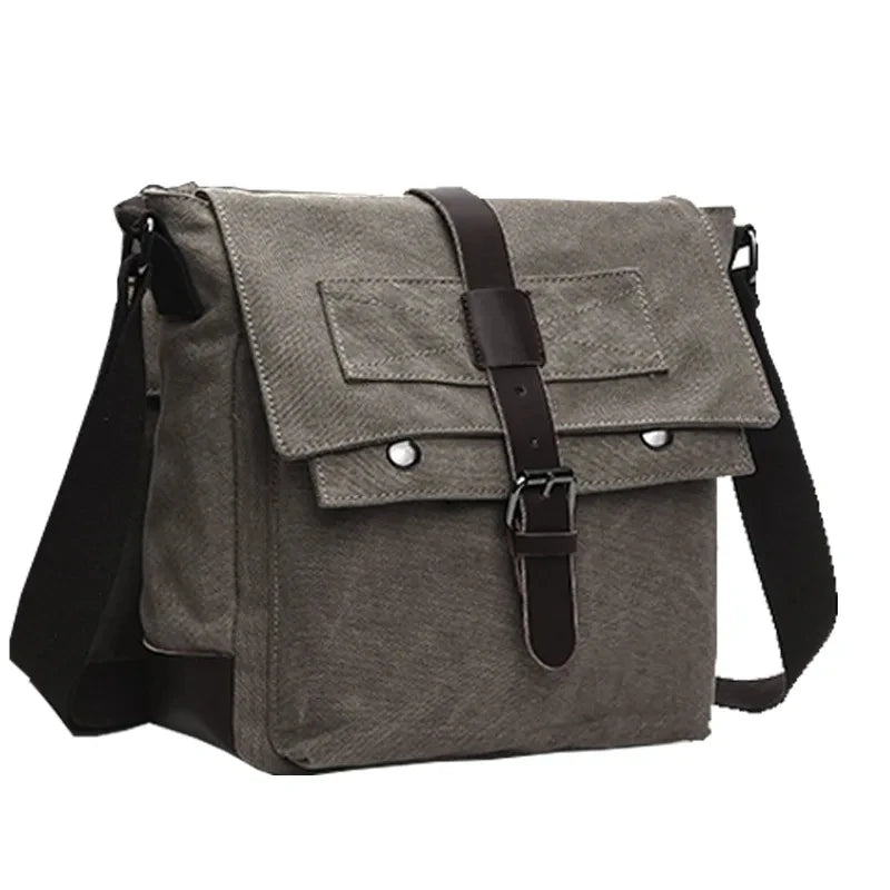 A gray canvas messenger bag for men with black straps and buckles.