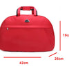 A red PU leather travel duffel bag with black handles shown from the top view.