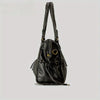 A black vintage washed leather tote bag with long straps and brass hardware.