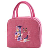 A pink insulated canvas lunch bag with a handle featuring floral embroidery.
