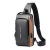Schwarze und beige Designer-Crossbody-Slingbag mit schwarzem Riemen.