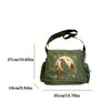 A dark olive green vintage canvas shoulder bag featuring a silhouette of a bird and foliage embroidery.