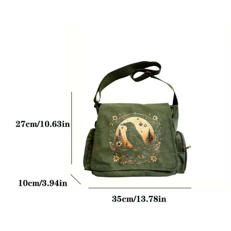A dark olive green vintage canvas shoulder bag featuring a silhouette of a bird and foliage embroidery.