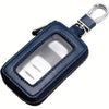 A dark blue retro PU leather car key case with a clear window and a metal hook.