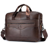 A brown genuine cowhide leather briefcase bag with padded straps and a flap closure.