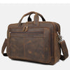 A brown genuine leather briefcase with a top handle and multiple compartments.