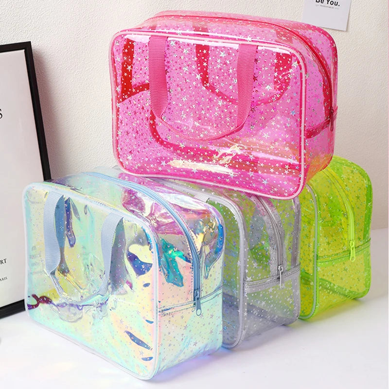 A clear waterproof makeup organizer bag in pink and green colors is shown on a white surface.