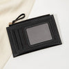 Portefeuille en cuir PU noir minimaliste avec rabat et fenêtre transparente sur fond blanc.