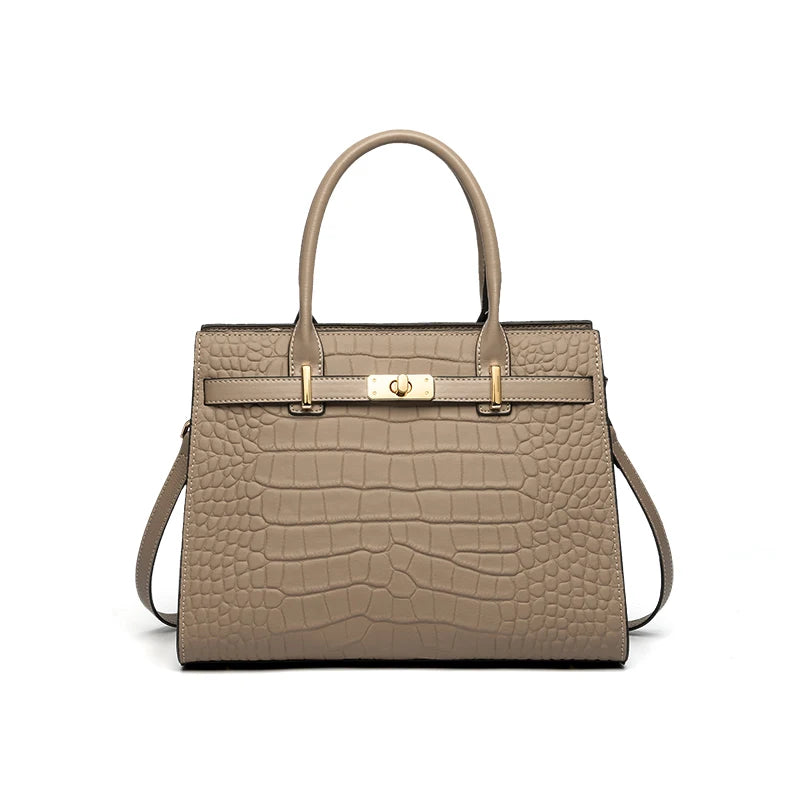 A tan genuine leather shoulder bag with a quilted pattern and gold hardware.