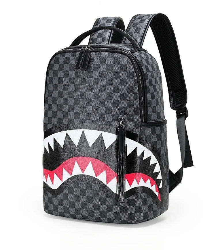 A black and gray checkered backpack featuring a stylized white and red shark tooth design.