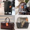 A collection of silicone luggage tags attached to a black suitcase, a gray backpack, and a brown leather bag.