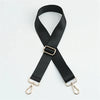 Black adjustable nylon shoulder strap with gold-toned hardware