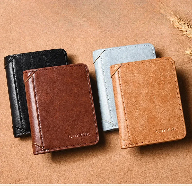 Three luxury PU leather men's wallets in black, light blue, and tan resting on a brown surface.