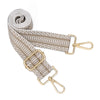 A beige woven nylon crossbody bag strap coiled and laid out against a white background.