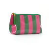 A green and pink striped cosmetic travel pouch with gold fringe.