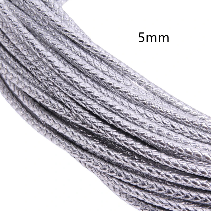 Close-up of a silver braided leather cord, 5mm in diameter.