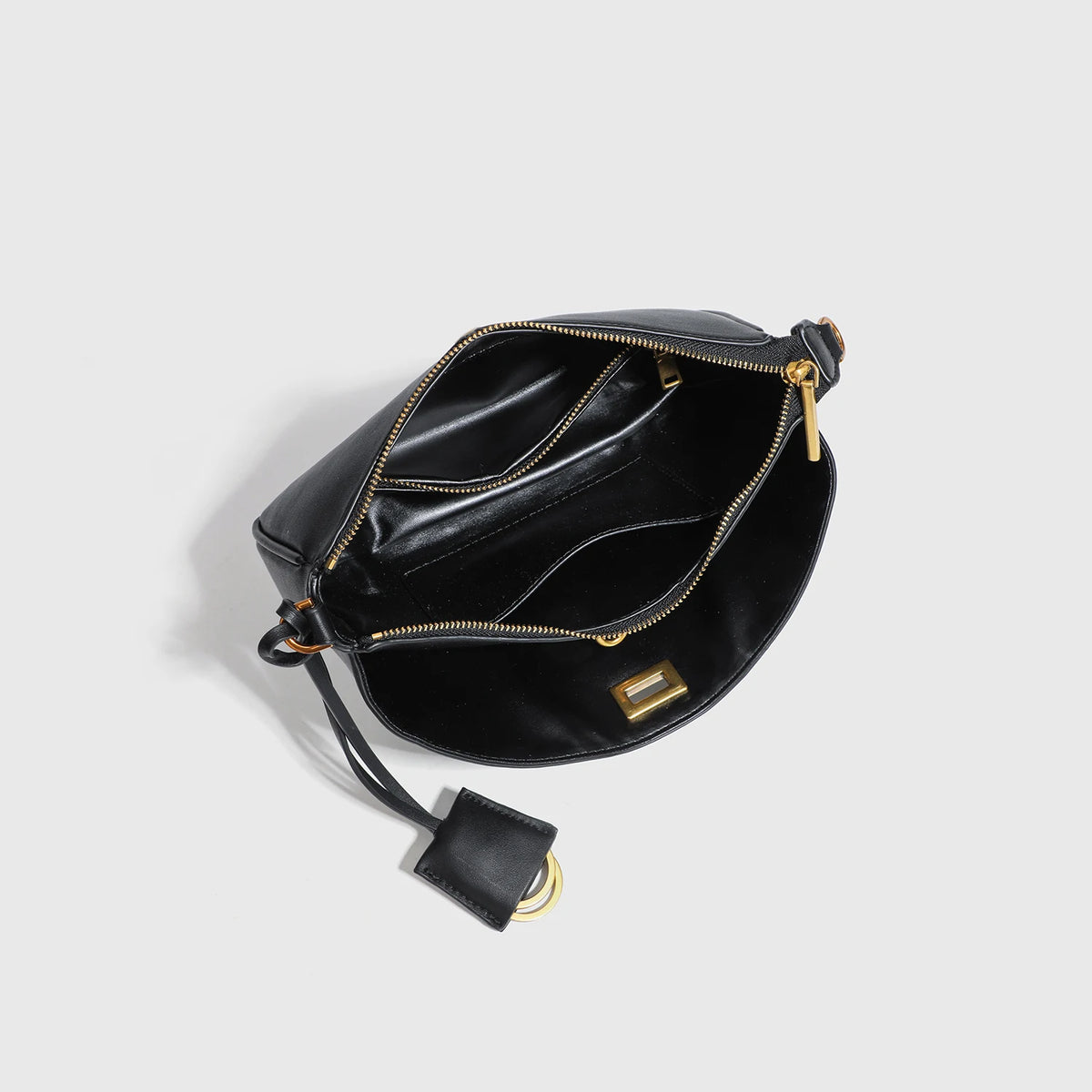 A black classic split leather shoulder tote bag with gold hardware.