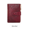 A deep wine red minimalist triple layer card holder wallet with a leather texture and gold zipper detail.