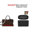 Black waterproof organizer insert for bags shown next to a leather replacement strap