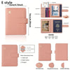 A pink E style passport organizer featuring card slots and a clear window for travel documents.