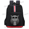 Black backpack featuring a gray cat face design and red and white stripes on the top.