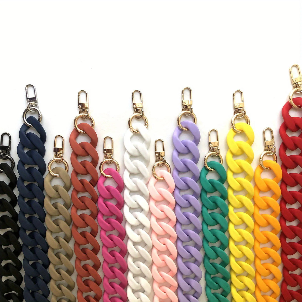 A collection of colorful acrylic chunky chain shoulder straps in various shades including blue, brown, pink, white, purple, g
