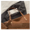 A brown leopard print tote bag is shown next to a gray blazer or jacket.