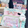 A pink and teal Y2K aesthetic transparent shoulder tote bag decorated with cat and bunny charms.