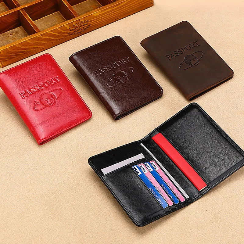 A set of genuine leather passport holders in brown and red colors displayed on a light background.