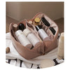 A pink cosmetic storage bag is open, revealing various beauty products like lipsticks and creams.