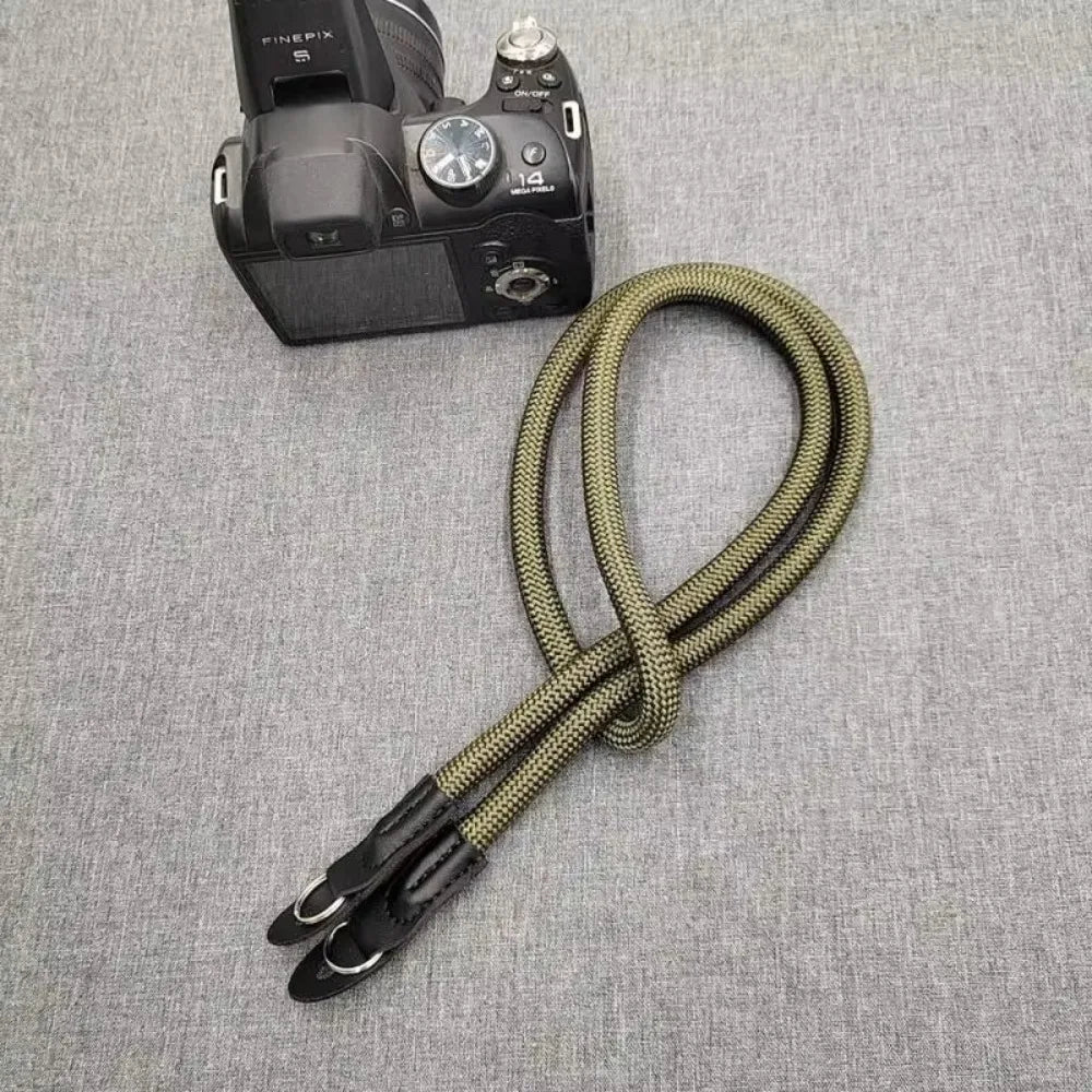 A black FinePix camera with an adjustable strap is shown against a gray background.