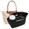 Black felt insert bag designed to organize and protect a handbag.