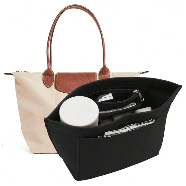 Black felt insert bag designed to organize and protect a handbag.